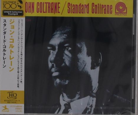 „JOHN COLTRANE / Standard Coltrane“ auf gelbem Hintergrund. Daneben japanische Schriftzeichen. Im Vordergrund ein Porträt.