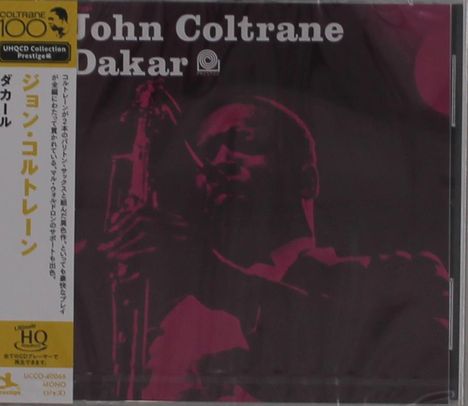 "John Coltrane Dakar" steht oben. Eine dunkle Silhouette eines Saxophonisten dominiert das Bild. Links sind japanische Schriftzeichen.