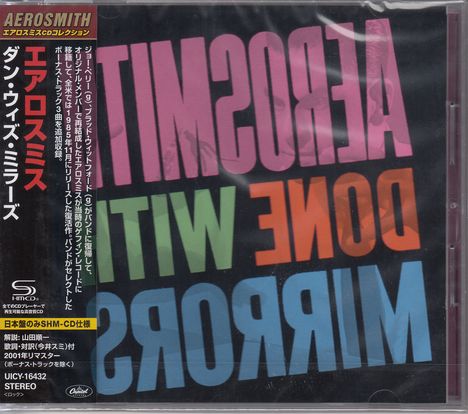 Links steht vertikal japanischer Text. Rechts groß: "AEROSMITH DONE WITH MIRRORS" in bunten Buchstaben.