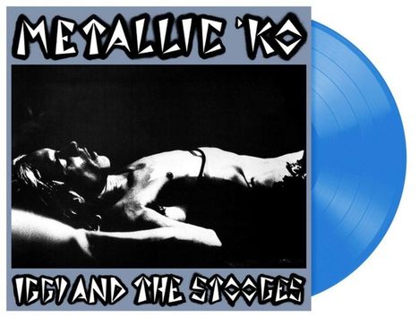 Text: "METALLIC 'KO", "IGGY AND THE STOOGES". Schwarz-Weiß-Foto eines liegenden Mannes, blaue Schallplatte.