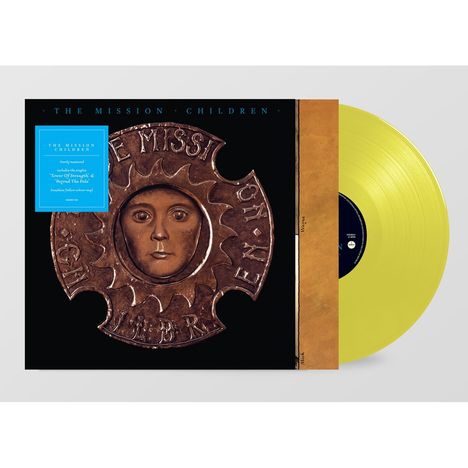 Text: "THE MISSION CHILDREN", "Includes the singles...", Illustration eines Medaillons mit Gesicht auf gelbem Vinyl.