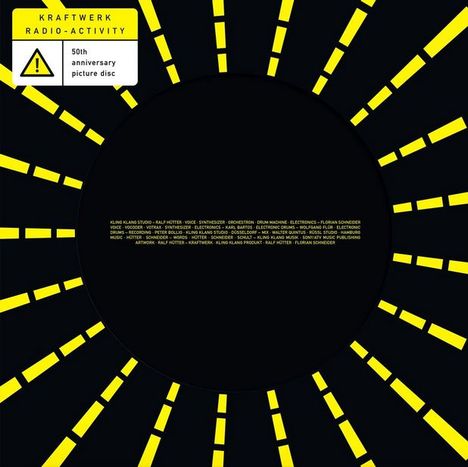 "KRAFTWERK RADIO-ACTIVITY 50th anniversary picture disc" steht im Bild. Ein gelb-schwarzes Strahlenmotiv, das ein Logo umgibt.