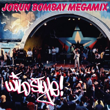 Text: "JORUN BOMBAY MEGAMIX", "Wild Style!" Szene: Konzert mit Bühne, buntes Wandgemälde, Menschenmenge jubelt.
