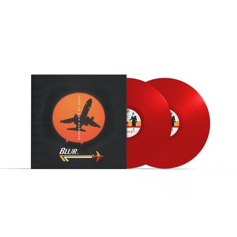 „LIVE AT THE BUDOKAN“ und „Blur“. Cover mit Flugzeug vor roter Sonne, zwei rote Schallplatten.