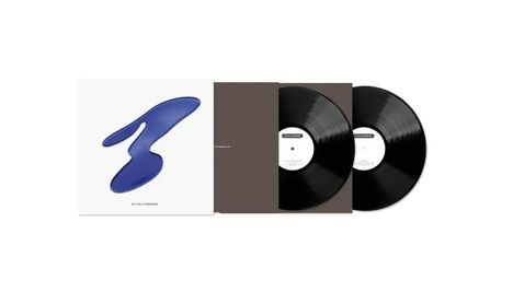 Texte: "It’s You I Wonder". Cover mit blauer Form, zwei schwarze Vinyl-Schallplatten sind zu sehen.