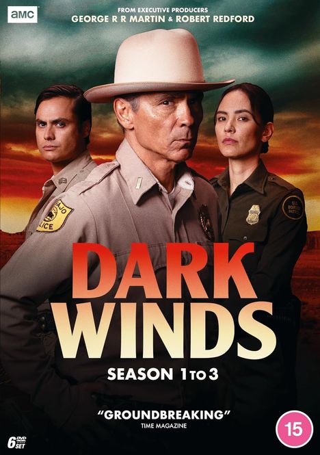 "DARK WINDS, SEASON 1 to 3, 'GROUNDBREAKING' TIME MAGAZINE." Drei Personen in Polizei-Uniformen mit ernstem Blick.