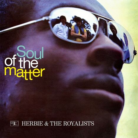 "Soul of the matter" in bunten Buchstaben. "HERBIE & THE ROYALISTS" darunter. Nahaufnahme eines Gesichts mit Sonnenbrille.