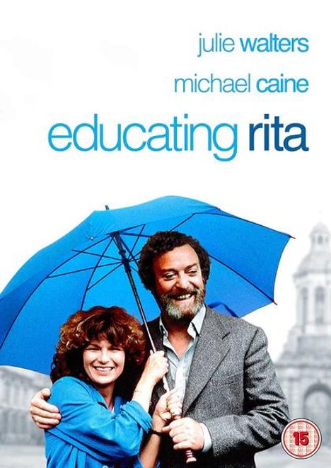 „Julie Walters, Michael Caine, Educating Rita“ – Fröhliche Frau mit lockigem Haar unter blauem Regenschirm, Mann daneben.