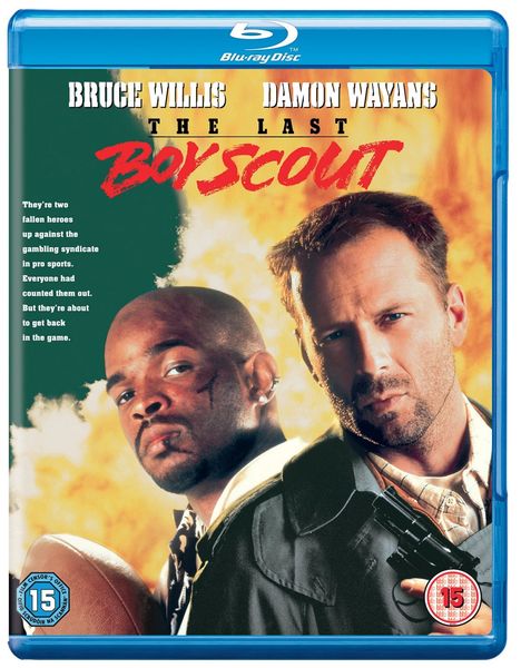 Bruce Willis, Damon Wayans, The Last Boy Scout. Zwei Männer, einer mit Football, einer mit Pistole, vor explosivem Hintergrund.