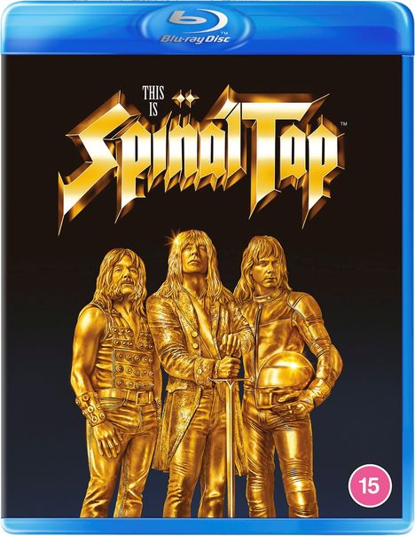 "THIS IS SPINAL TAP" in goldener Schrift oben, darunter goldene Statuen von drei langhaarigen Männern in Rock-Outfits.