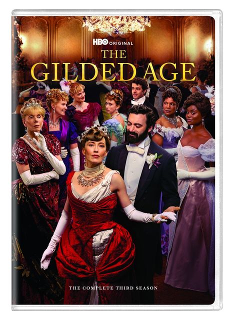 „THE GILDED AGE“; elegante Menschen in festlicher Kleidung in einem prunkvollen Saal.