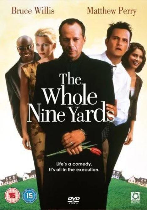 Der Text zeigt: "The Whole Nine Yards. Life's a comedy. It's all in the execution." Vier Personen stehen nebeneinander.