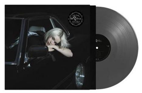Text: "Limited Edition".
Eine Frau mit blonden Haaren lehnt aus einem Autofenster. Daneben eine graue Schallplatte.