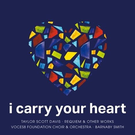 "i carry your heart" steht unten auf einem dunklen Hintergrund. Darüber ein Herz aus bunten Mosaikstücken.