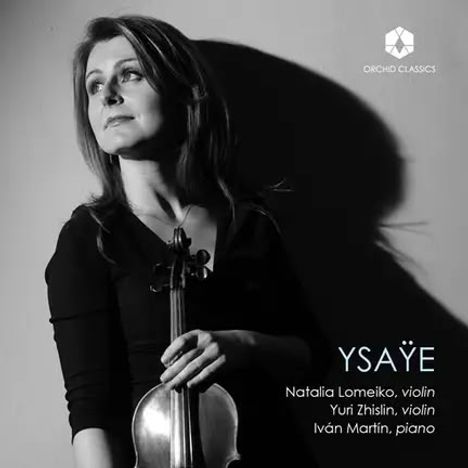 "Ysaye. Natalia Lomeiko, violin. Yuri Zhislin, violin. Iván Martín, piano." Frau mit Geige, nachdenklich posierend.