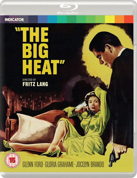"THE BIG HEAT" steht in gelben Buchstaben. Eine Frau in einem grünen Kleid telefoniert, ein Mann hält eine Waffe.
