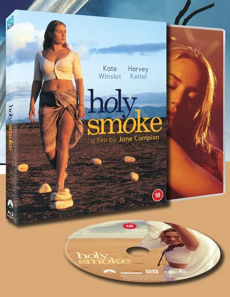 Boxcover von "holy smoke" zeigt Frau am Strand. Namen: Kate Winslet, Harvey Keitel. Regie: Jane Campion. DVD darunter.