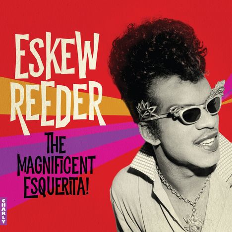 Text: "ESKEW REEDER THE MAGNIFICENT ESQUERITA!" Illustration: Ein Mann in Sonnenbrille, Hintergrund in Rot und bunten Streifen.