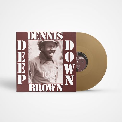 Dennis Brown: Deep Down. Foto von lächelndem Mann in Mütze, braunes Cover, goldene Schallplatte daneben.