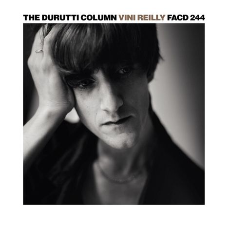 Text: "THE DURUTTI COLUMN VINI REILLY FACD 244". Schwarz-weiß Foto einer Person mit nachdenklichem Ausdruck.