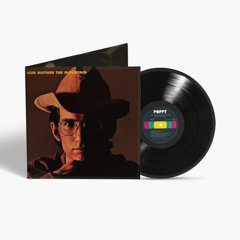 Text: "OUR MOTHER THE MOUNTAIN", "POPPY". Darstellung: Vinyl-Schallplatte und Albumhülle mit Mann in Cowboyhut und Brille.