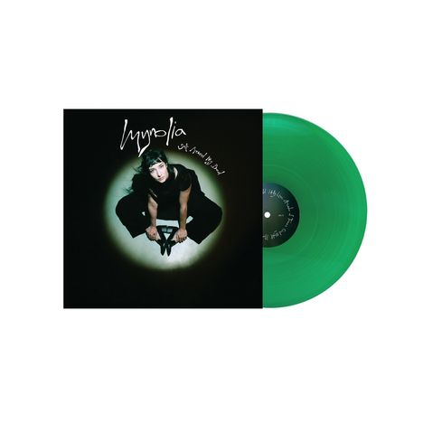 Text: "Hypnolia", "Self Fulfilling Prophecy". Eine Frau in Schwarz sitzt auf dem Boden. Eine grüne Vinylplatte.