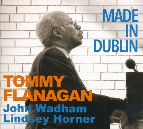 "MADE IN DUBLIN" steht rechts oben. "TOMMY FLANAGAN", "John Wadham", "Lindsey Horner" darunter. Ein Mann spielt Klavier.