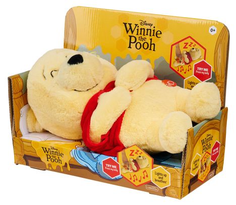 "Winnie the Pooh", Plüschfigur in rotem Shirt, mit Verpackung. Hinweise: "Try me, press my belly", "Lights up and breathes".