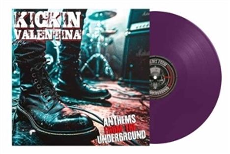 Covertext: "Kickin Valentina - Anthems from the Underground". Großer schwarzer Stiefel auf einer Bühne, lila Vinyl.