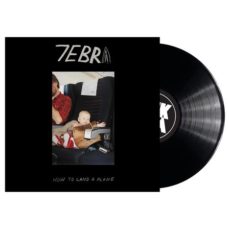 Text: "ZEBRA" oben mittig, "HOW TO LAND A PLANE" unten. Ein Baby sitzt in einem Flugzeugsitz. Schallplatten-Cover.