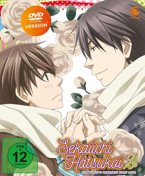 "DVD Video Version", "Sekaiichi Hatsukoi 2", "FSK ab 12 freigegeben". Illustration: Zwei Personen halten Hände, flankiert von Rosen.