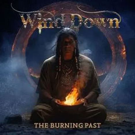„Wind Down“, „The Burning Past“; Mensch sitzend mit Feuer in den Händen, dunkle Atmosphäre, symbolische Darstellung.
