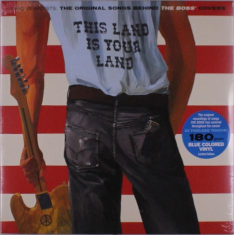 Dieses Bild zeigt eine Person von hinten, die eine Gitarre hält. Ihr T-Shirt trägt den Text "THIS LAND IS YOUR LAND". Ein blauer Sticker verkündet: "180 gram BLUE COLORED VINYL Limited Edition". Im Hintergrund sind rote und weiße Streifen.