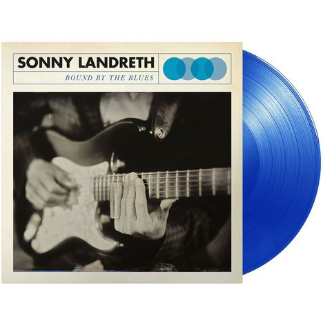 Aufschrift: "Sonny Landreth Bound By The Blues". Schwarz-weiß Foto: Person spielt Gitarre. Blaue Vinyl-Schallplatte.
