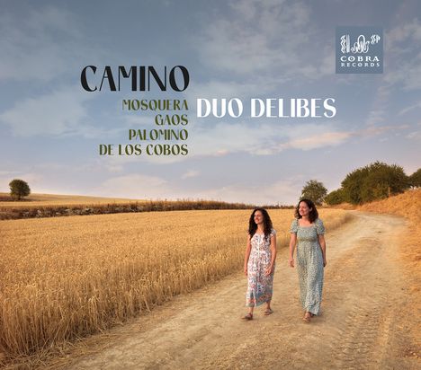 „CAMINO“, „Mosquera“, „Gaos“, „Palomino“, „De los Cobos“, „DUO DELIBES“. Zwei Frauen auf einem Feldweg im Sommer.