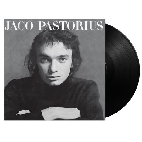 Text: "JACO PASTORIUS". Schwarz-weißes Albumcover mit Porträt einer Person in einem schwarzen Pullover.