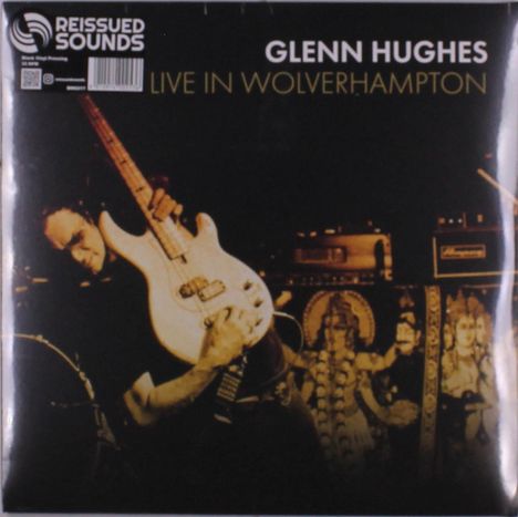 Der Text oben links lautet "REISSUED SOUNDS". Rechts steht "GLENN HUGHES" und darunter "LIVE IN WOLVERHAMPTON". Ein Musiker mit Gitarre.