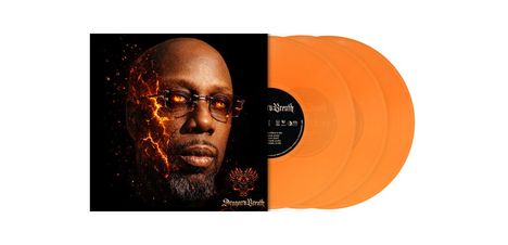 „Dragon’s Breath“ und Flammengrafik unten. Gesicht eines Mannes, dessen rechter Teil in Flammen übergeht. Drei orangefarbene Schallplatten.