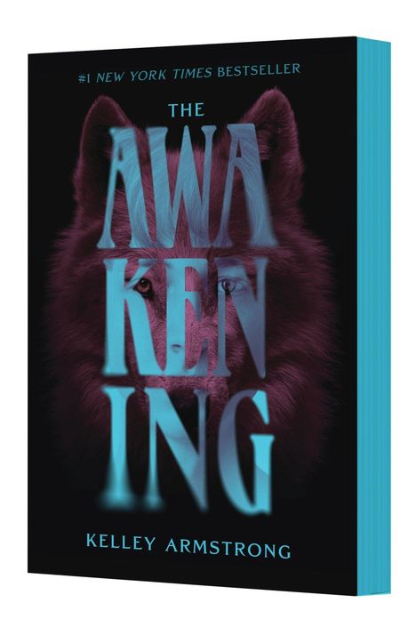 Buchtitel: "The Awakening" von Kelley Armstrong, #1 New York Times Bestseller. Ein Wolf im Hintergrund.