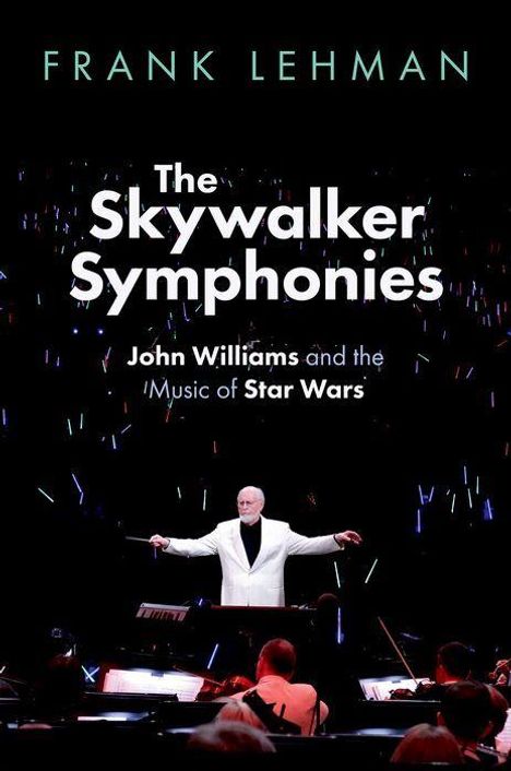 "Frank Lehman: The Skywalker Symphonies, John Williams and the Music of Star Wars. Dirigent im weißen Anzug vor Orchester."