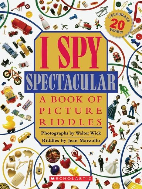"I SPY SPECTACULAR: A Book of Picture Riddles" von Walter Wick und Jean Marzollo. Bunte Objekte überziehen den Hintergrund.