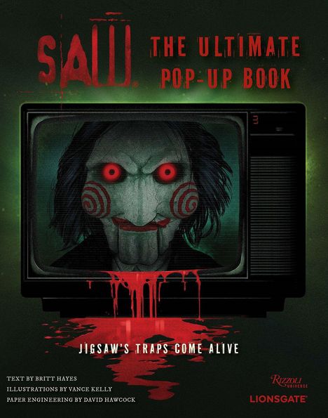 "SAW: The Ultimate Pop-Up Book. Jigsaw's traps come alive." Ein gruseliges Gesicht mit roten Augen, blutige Details.