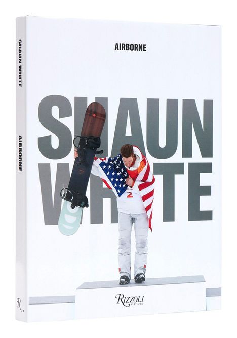 "Shaun White", "AIRBORNE", "RIZZOLI". Snowboarder mit Flagge, weißer Hintergrund.