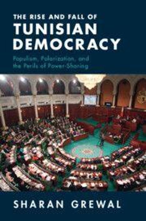 "The Rise and Fall of Tunisian Democracy" von Sharan Grewal. Ein runder Saal, gefüllt mit Personen in Sitzreihen.