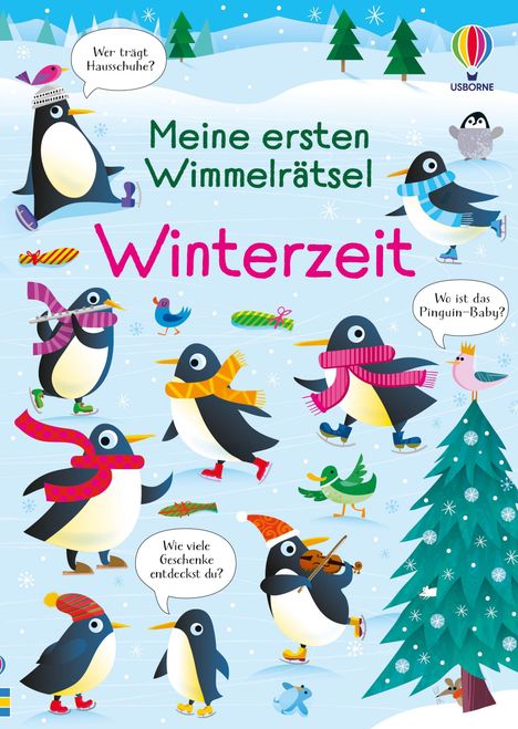 „Meine ersten Wimmelrätsel: Winterzeit“ steht auf einem winterlichen Bild mit fröhlichen, aktiv spielenden Pinguinen.