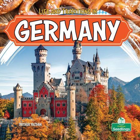 "Life and Traditions in Germany", ein Schloss in herbstlicher Landschaft, Berge im Hintergrund, unten Brezeln.
