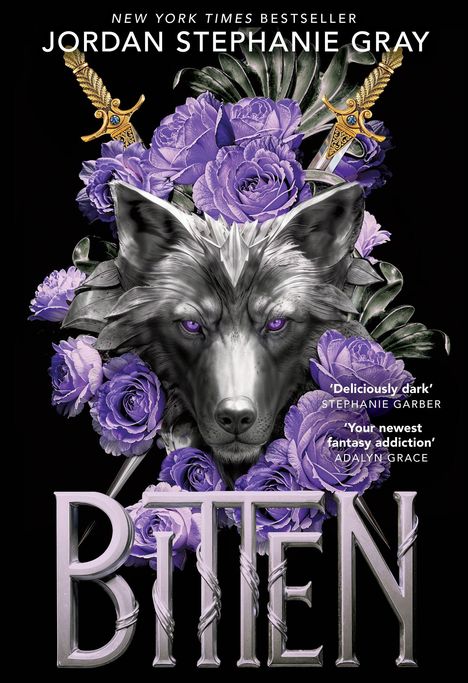 Buchcover: "Jordan Stephanie Gray: Bitten." Wolfskopf umgeben von lila Rosen; zwei goldene Schwerter im Hintergrund.
