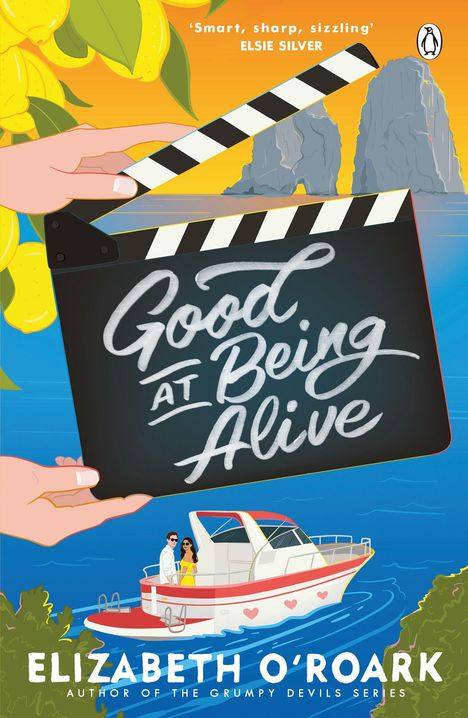 Text: „Good at Being Alive“, „Smart, sharp, sizzling“, Elsie Silver, Elizabeth O'Roark. Eine Klappe über Wasser mit Boot.