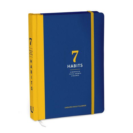 „7 Habits: 12 Months of Focus, Growth & Balance“, blauer und gelber Kalender mit elastischem Band.
