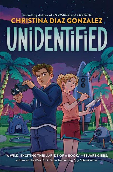 „Bestselling Author of Invisible and Offside“, „Christina Diaz Gonzalez: Unidentified“. Kinder mit Geräten, UFO, Palmen.